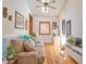 Comfortable living room features a modern ceiling fan, hardwood floors, and plenty of natural light at 794 Rutland Ct, Lithonia, GA 30058