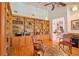 Cozy living room featuring hardwood floors, custom wood shelving, and elegant decor at 794 Rutland Ct, Lithonia, GA 30058