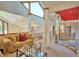 Open second-story living room featuring carpet floors, natural light, and cozy seating area at 794 Rutland Ct, Lithonia, GA 30058