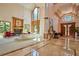 Bright living room boasts a fireplace, high ceilings, and large windows showcasing backyard views at 794 Rutland Ct, Lithonia, GA 30058