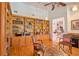 Spacious home office featuring built-in bookshelves, hardwood floors, and comfortable seating for a productive workspace at 794 Rutland Ct, Lithonia, GA 30058