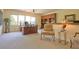 Inviting home office boasts a large desk, comfortable chair, built-in shelves, and natural light at 794 Rutland Ct, Lithonia, GA 30058