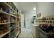 Well-stocked pantry with ample shelving and storage, including a sink and additional storage space at 794 Rutland Ct, Lithonia, GA 30058