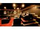 Home theater with tiered seating, plush reclining chairs, a projector, and framed movie posters at 794 Rutland Ct, Lithonia, GA 30058