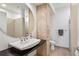 Bathroom featuring a modern sink, large mirror, and a combination shower and toilet at 805 Peachtree Ne St # 411, Atlanta, GA 30308