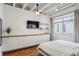 Bright bedroom featuring built-in cabinets, hardwood floors, and a large window at 805 Peachtree Ne St # 411, Atlanta, GA 30308