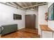 Spare bedroom showing hardwood floors, murphy bed and built in desk and shelving at 805 Peachtree Ne St # 411, Atlanta, GA 30308