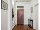 Hallway with a wood door, coat rack and an accent table at 805 Peachtree Ne St # 411, Atlanta, GA 30308