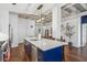 Kitchen island with a white countertop and stainless steel appliances at 805 Peachtree Ne St # 411, Atlanta, GA 30308