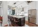 Open kitchen with island seating and stainless steel appliances at 805 Peachtree Ne St # 411, Atlanta, GA 30308