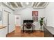Office space featuring hardwood floors, large monitor and built in shelving at 805 Peachtree Ne St # 411, Atlanta, GA 30308