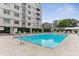 Community pool area with lounge chairs and well-maintained landscaping at 805 Peachtree Ne St # 411, Atlanta, GA 30308
