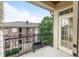 Private balcony with wrought iron railing overlooking courtyard and surrounding buildings at 825 Highland Lane Northeast Ne # 1313, Atlanta, GA 30306
