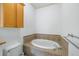 Bright bathroom features a soaking tub with tile surround, with adjacent toilet at 825 Highland Lane Northeast Ne # 1313, Atlanta, GA 30306