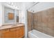 Cozy bathroom featuring wood cabinets, bathtub with tile, and neutral walls at 825 Highland Lane Northeast Ne # 1313, Atlanta, GA 30306