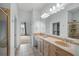 Bright bathroom featuring double vanity, large mirror, walk-in closet, and glass shower at 825 Highland Lane Northeast Ne # 1313, Atlanta, GA 30306