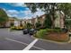 Exterior angle view of a brick building with lush landscaping and plenty of parking at 825 Highland Lane Northeast Ne # 1313, Atlanta, GA 30306