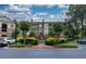 Beautiful brick condo building with meticulously maintained landscaping, a secure gate, and private balconies at 825 Highland Lane Northeast Ne # 1313, Atlanta, GA 30306