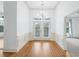 Elegant foyer featuring hardwood floors, a modern chandelier, and access to other rooms at 825 Highland Lane Northeast Ne # 1313, Atlanta, GA 30306