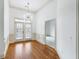 Hallway with hardwood floors, white trim and walls, and a modern light fixture at 825 Highland Lane Northeast Ne # 1313, Atlanta, GA 30306