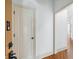 Hallway with hardwood floors and white trim at 825 Highland Lane Northeast Ne # 1313, Atlanta, GA 30306