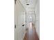 Hallway featuring hardwood floors, crown molding, and closet for storage at 825 Highland Lane Northeast Ne # 1313, Atlanta, GA 30306