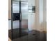 A stainless steel refrigerator, microwave, and black granite countertop on the kitchen island creates a modern space at 825 Highland Lane Northeast Ne # 1313, Atlanta, GA 30306