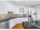Well-equipped kitchen featuring stainless steel appliances, granite counters, and ample cabinet space at 825 Highland Lane Northeast Ne # 1313, Atlanta, GA 30306