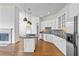 Open-concept kitchen with granite countertops, stainless steel appliances, and hardwood floors at 825 Highland Lane Northeast Ne # 1313, Atlanta, GA 30306