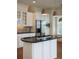 Stylish kitchen island with granite countertop, gas cooktop, and pendant lighting, perfect for cooking and entertaining at 825 Highland Lane Northeast Ne # 1313, Atlanta, GA 30306