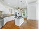 Open-concept kitchen with modern cabinets, stainless steel appliances, a kitchen island and hardwood floors at 825 Highland Lane Northeast Ne # 1313, Atlanta, GA 30306