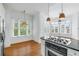 Bright kitchen with hardwood floors, stainless steel appliances, and large windows providing ample natural light at 825 Highland Lane Northeast Ne # 1313, Atlanta, GA 30306
