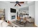 Spacious living room with an open floor plan, fireplace, and view into the kitchen, creating a welcoming atmosphere at 825 Highland Lane Northeast Ne # 1313, Atlanta, GA 30306