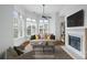 Inviting living room with a fireplace, large windows, and comfortable seating, perfect for relaxation and entertaining at 825 Highland Lane Northeast Ne # 1313, Atlanta, GA 30306