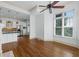 Spacious living area with a ceiling fan, large windows, and seamless access to the adjacent kitchen at 825 Highland Lane Northeast Ne # 1313, Atlanta, GA 30306