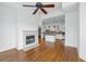 Spacious living room with hardwood floors, fireplace, and open access to the modern kitchen at 825 Highland Lane Northeast Ne # 1313, Atlanta, GA 30306