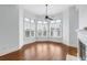 Bright living room featuring hardwood floors, a cozy fireplace, and large windows with natural light at 825 Highland Lane Northeast Ne # 1313, Atlanta, GA 30306