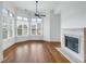 Inviting living room with hardwood floors, fireplace, and a bank of windows offering natural light at 825 Highland Lane Northeast Ne # 1313, Atlanta, GA 30306