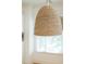 Pendant light fixture made of natural fiber hanging above the kitchen bar area at 825 Highland Lane Northeast Ne # 1313, Atlanta, GA 30306