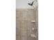 Shower featuring beige tile surround with tiled inlay and adjustable shower head at 825 Highland Lane Northeast Ne # 1313, Atlanta, GA 30306
