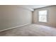 This neutral bedroom features carpet flooring, window with blinds, and plenty of natural light at 3650 Ashford Dunwoody Ne Rd # 514, Atlanta, GA 30319