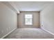 Cozy bedroom with neutral walls, plush carpet, and a window showcasing natural light at 3650 Ashford Dunwoody Ne Rd # 514, Atlanta, GA 30319