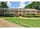 Charming brick building with balconies and manicured landscaping offers inviting curb appeal at 3650 Ashford Dunwoody Ne Rd # 514, Atlanta, GA 30319