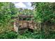 Picturesque wooden gazebo overlooking a tranquil lake surrounded by vibrant greenery at 3650 Ashford Dunwoody Ne Rd # 514, Atlanta, GA 30319