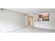Open living area featuring neutral walls and carpet flowing into adjacent kitchen space at 3650 Ashford Dunwoody Ne Rd # 514, Atlanta, GA 30319