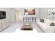 Open-concept living room with kitchen view and modern decor creates an inviting space at 3650 Ashford Dunwoody Ne Rd # 514, Atlanta, GA 30319