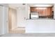Bright living area with neutral walls and plush carpet leading to the kitchen at 3650 Ashford Dunwoody Ne Rd # 514, Atlanta, GA 30319