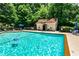 Community pool surrounded by lush greenery and comfortable lounge chairs for relaxation at 3650 Ashford Dunwoody Ne Rd # 514, Atlanta, GA 30319