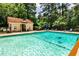 Inviting community pool surrounded by trees offers a refreshing and relaxing amenity at 3650 Ashford Dunwoody Ne Rd # 514, Atlanta, GA 30319