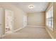 Bedroom with neutral walls, carpeting, a window with blinds, and an en-suite bathroom at 5060 Windcrest Lane, Alpharetta, GA 30022